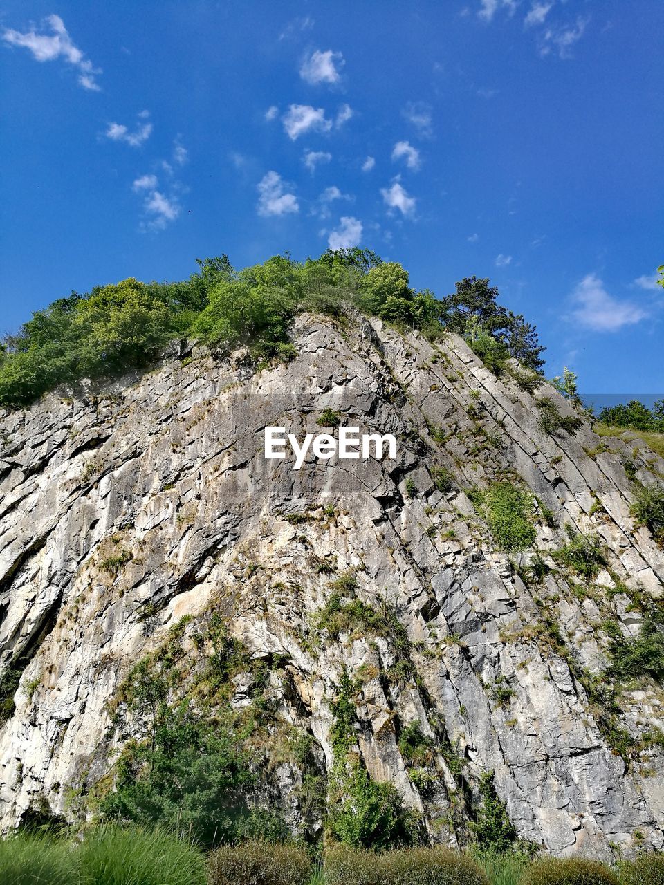 LOW ANGLE VIEW OF ROCKS AGAINST SKY