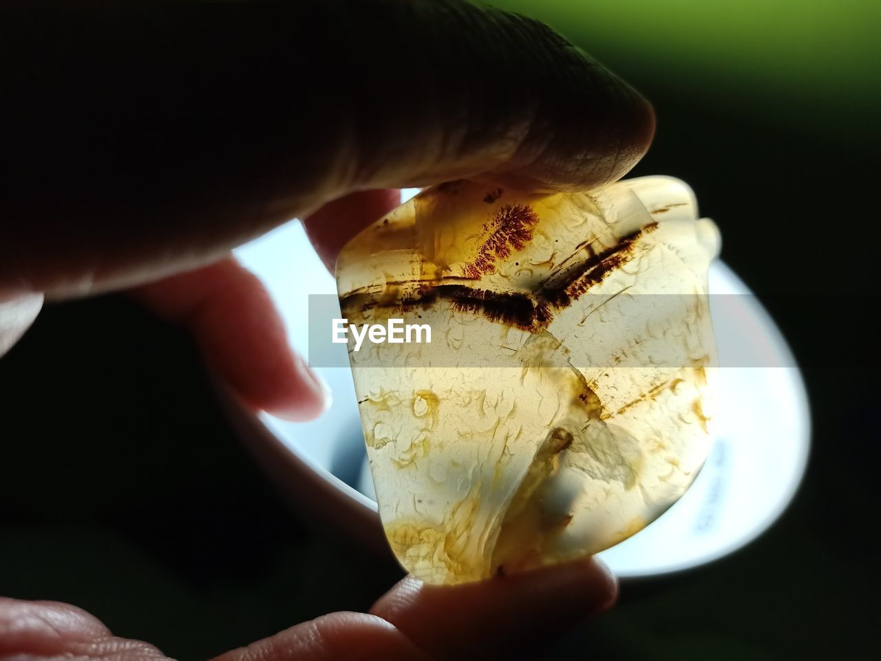 Close-up of person holding semi-precious stone