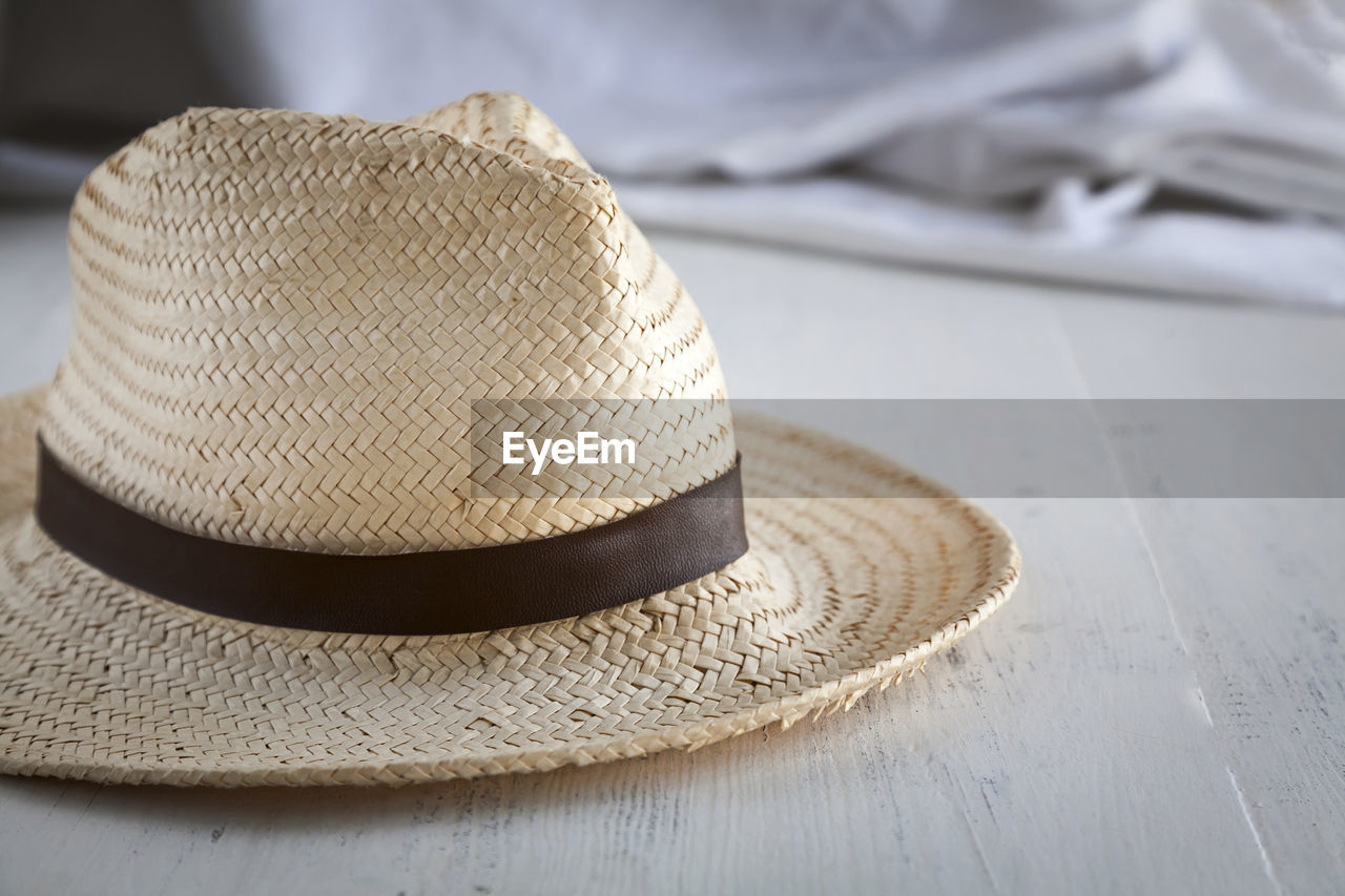 Close-up of sun hat on table