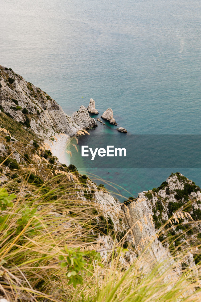 High angle view of rocks on sea