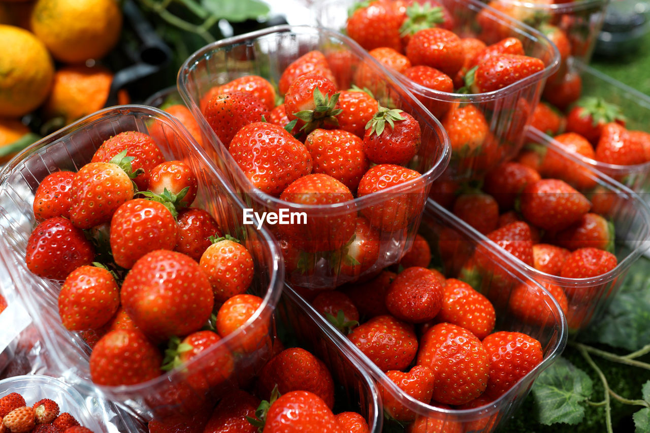 STRAWBERRIES IN MARKET STALL