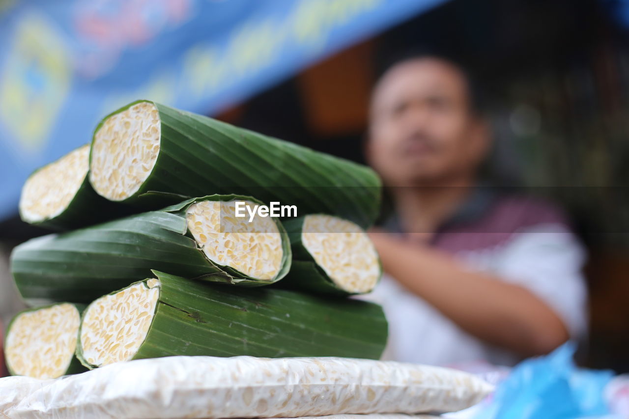 Close-up of food wrapped in banana leaves in market