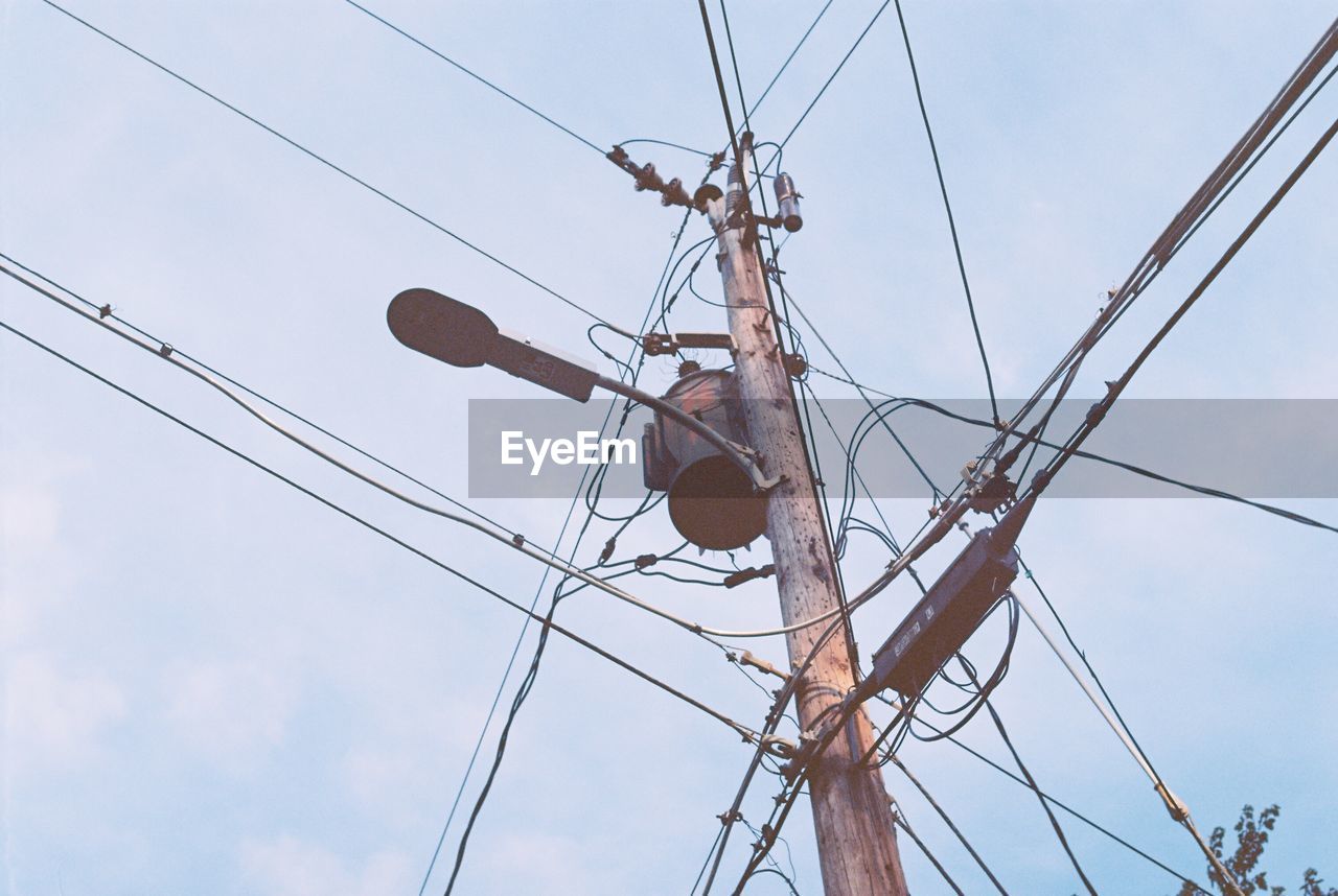 LOW ANGLE VIEW OF ELECTRICITY PYLON