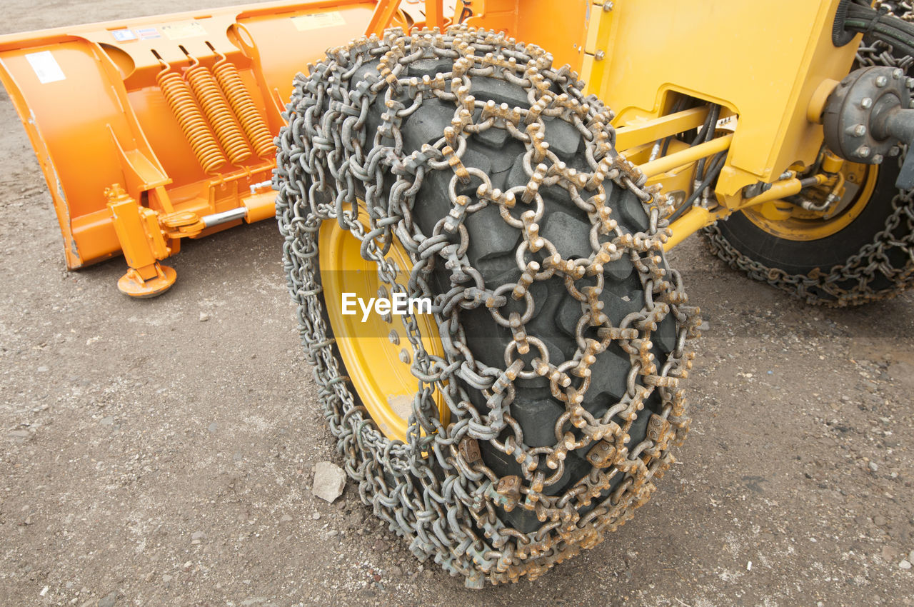 High angle view of chain on earthmover tire