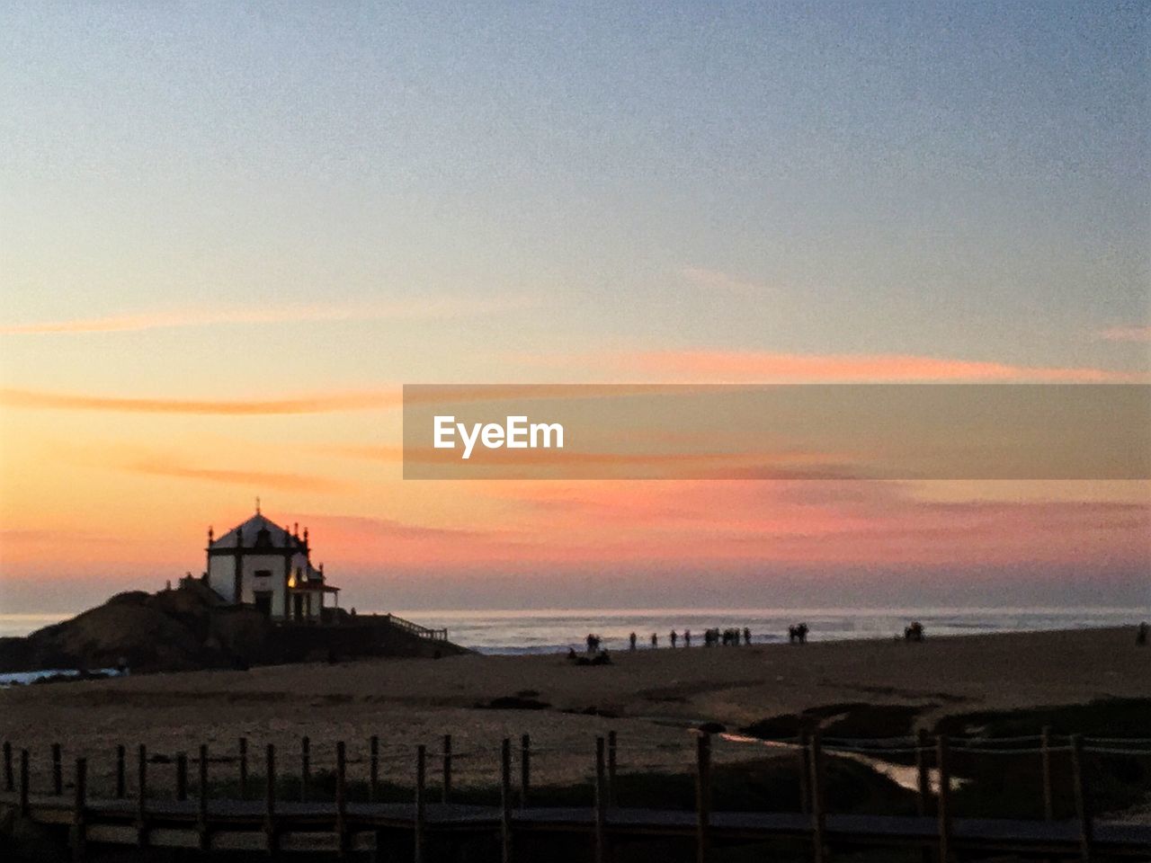 SCENIC VIEW OF SEA AT SUNSET