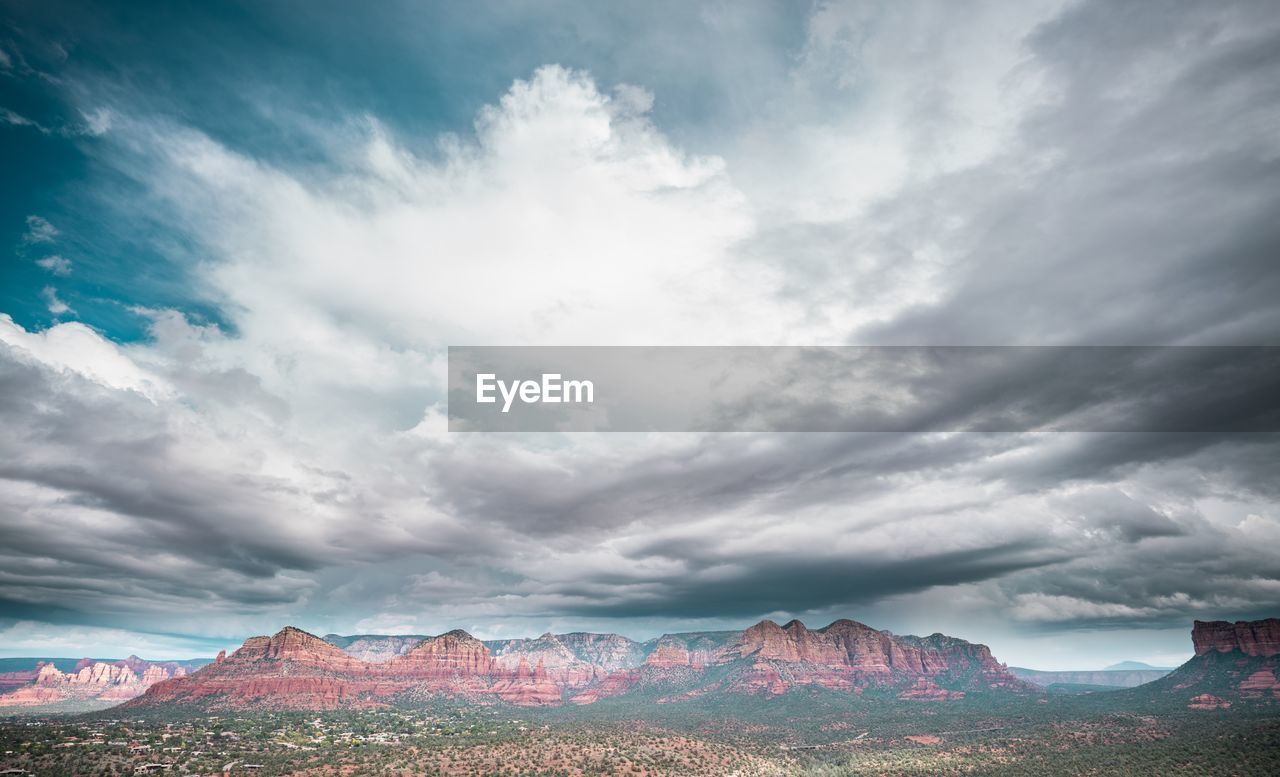 Panoramic view of landscape against cloudy sky