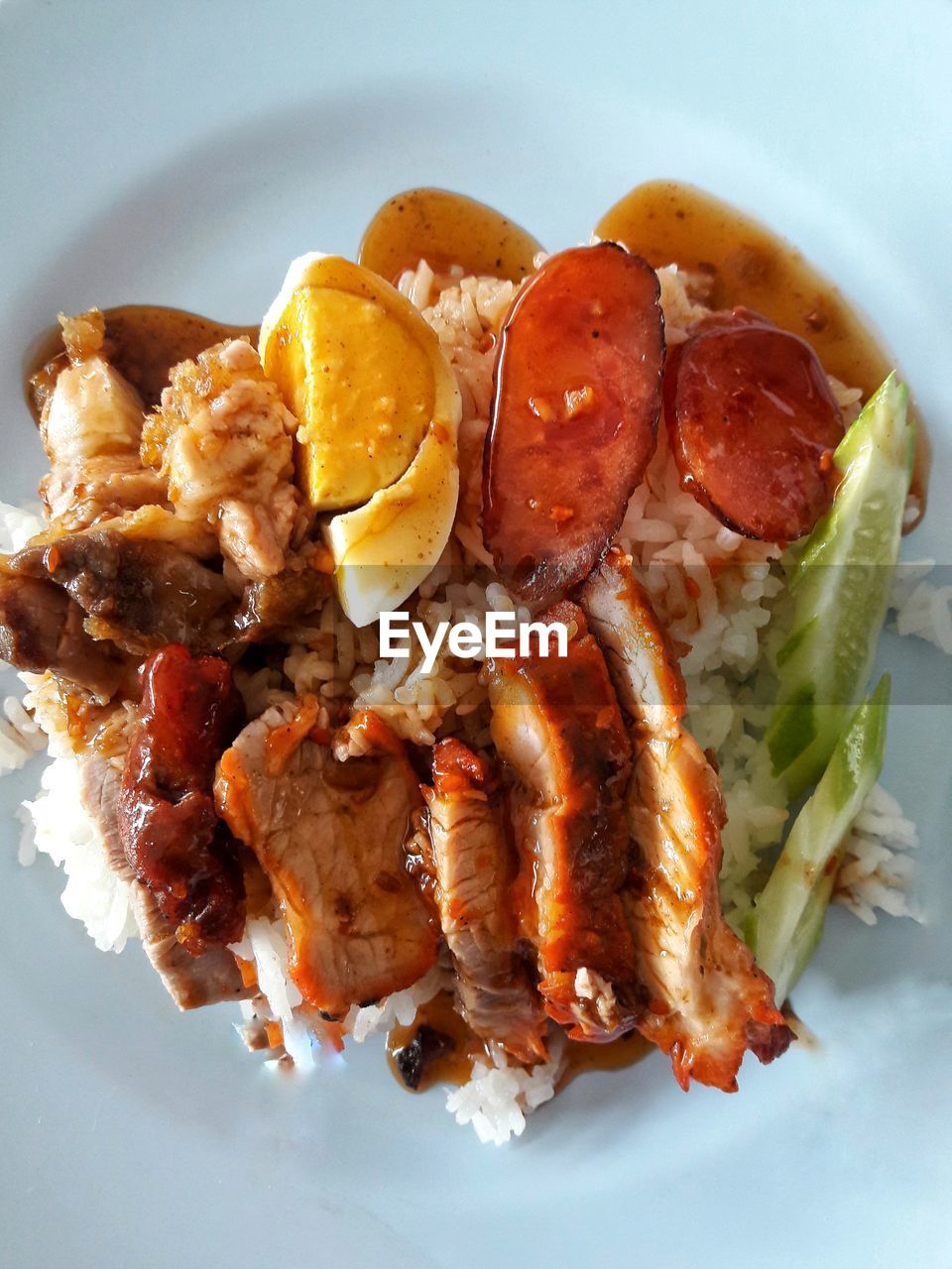 Barbecued red pork in sauce with rice