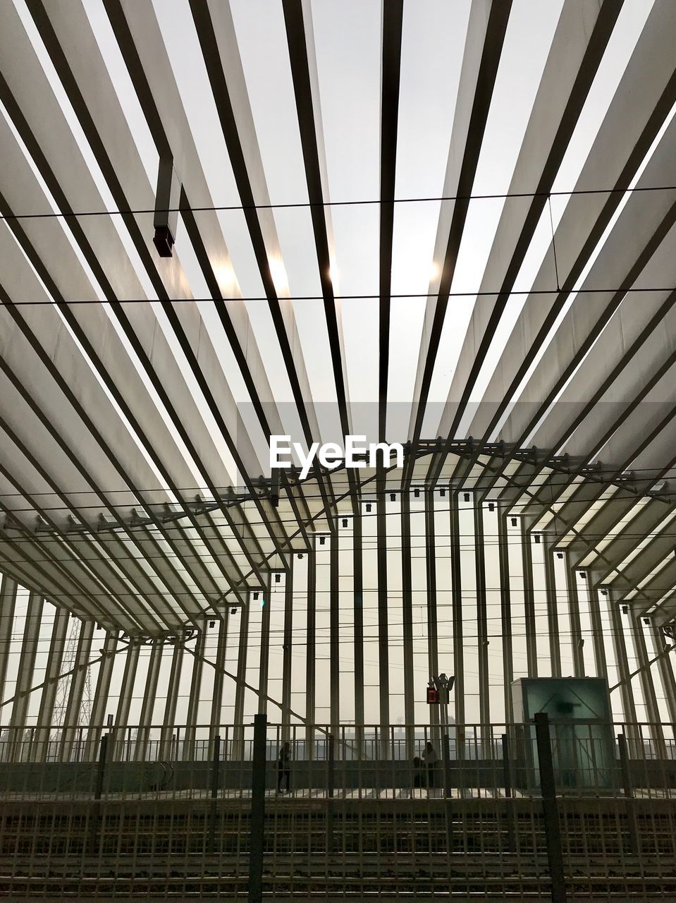 LOW ANGLE VIEW OF RAILROAD STATION AGAINST CEILING