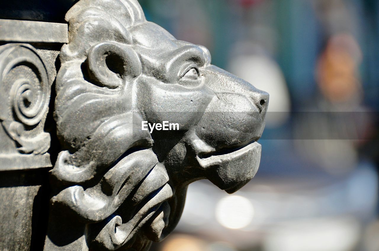 Close-up of metallic lion sculpture