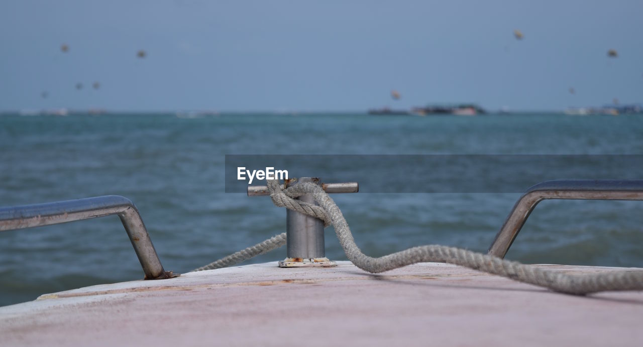 Close-up of rope on boat against clear sky