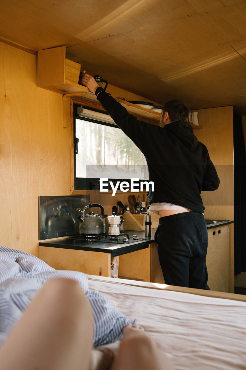 Man preparing coffee in motor home