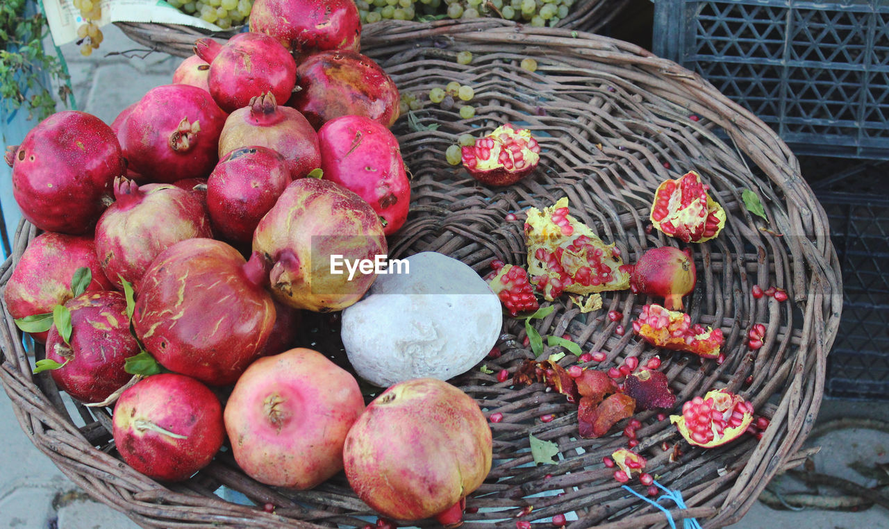 CLOSE-UP OF RED FRUIT ON TABLE