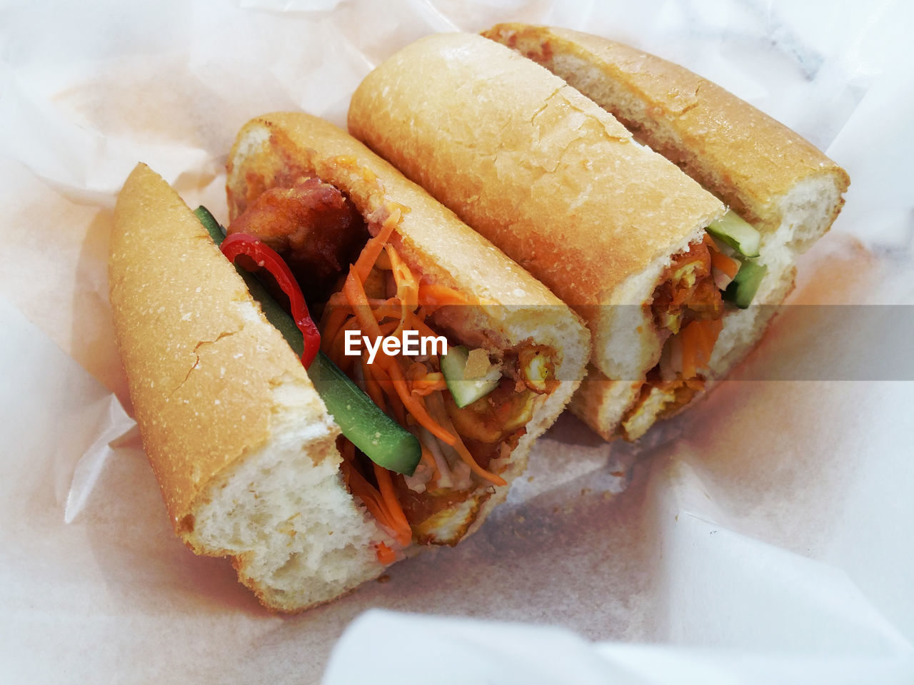 High angle view of fresh banh mi in tissue