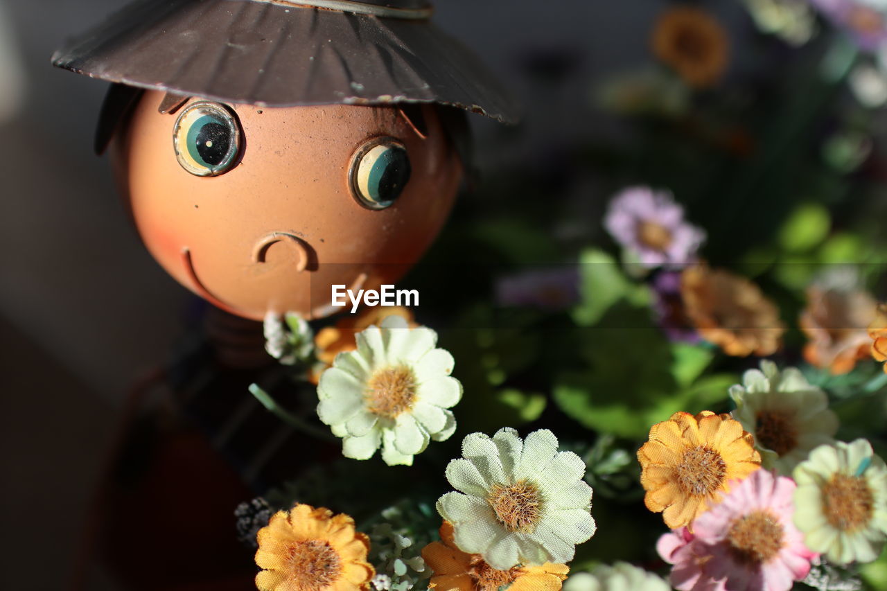 CLOSE-UP OF FLOWERS IN BASKET