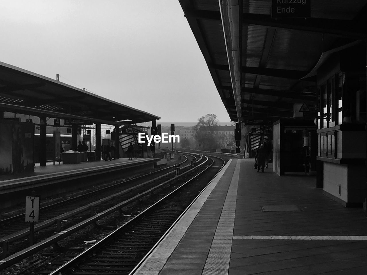 Railroad station platform against clear sky