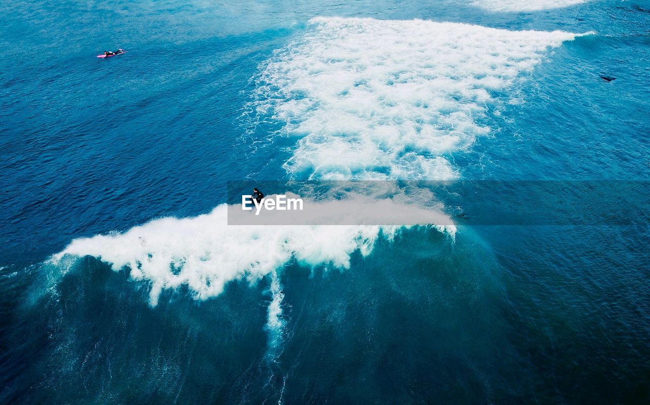 High angle view of man surfing in sea