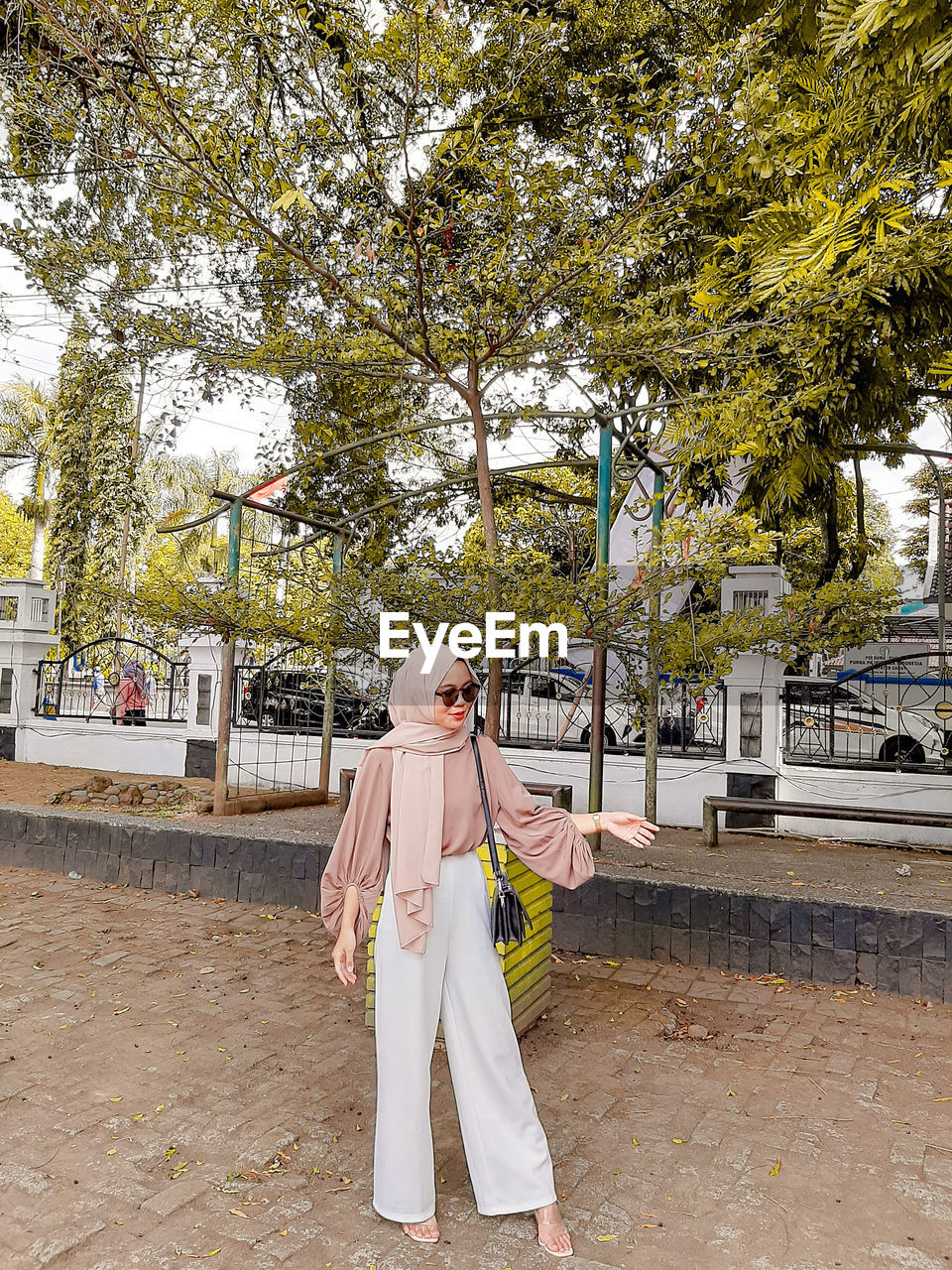 Full length of woman wearing hijab standing at park