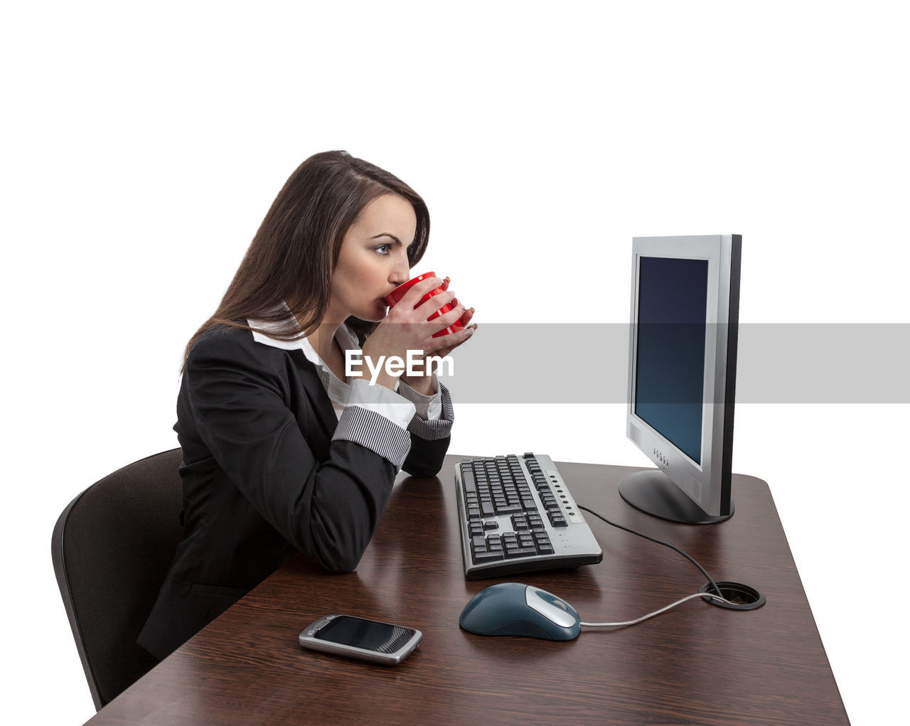 WOMAN USING SMART PHONE WHILE SITTING ON TABLE