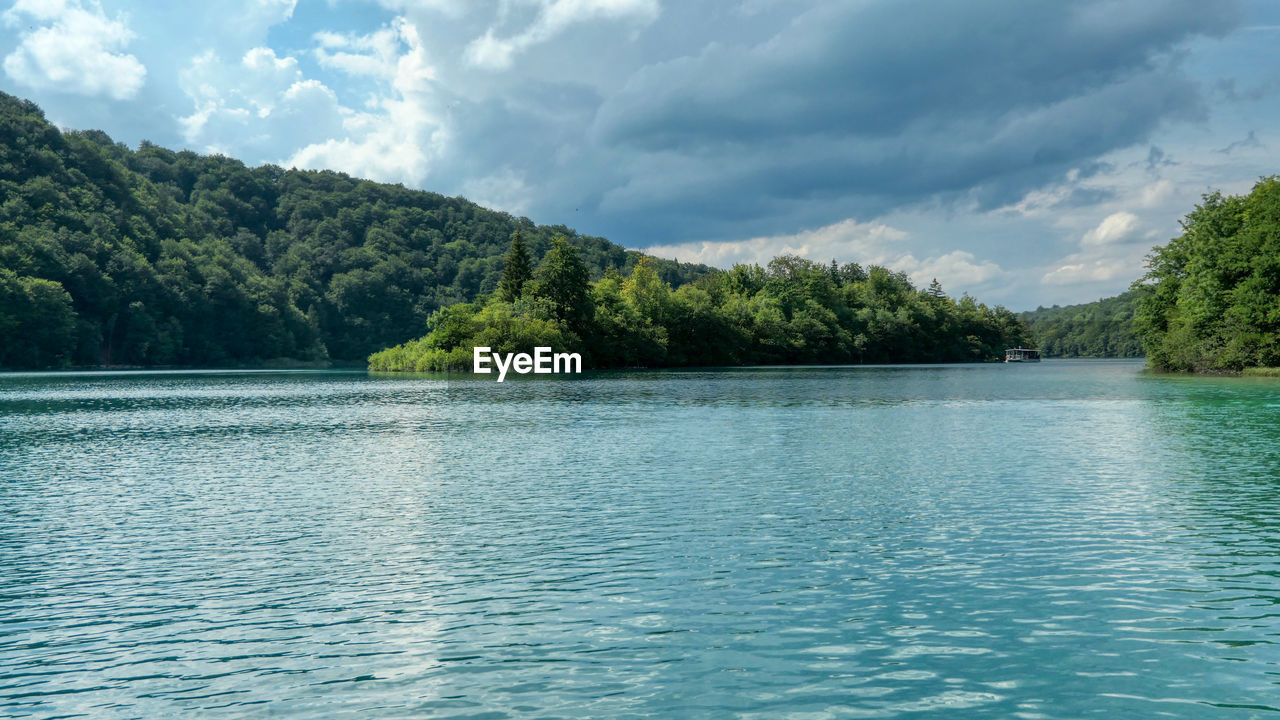 Scenic view of kozjak lake against sky