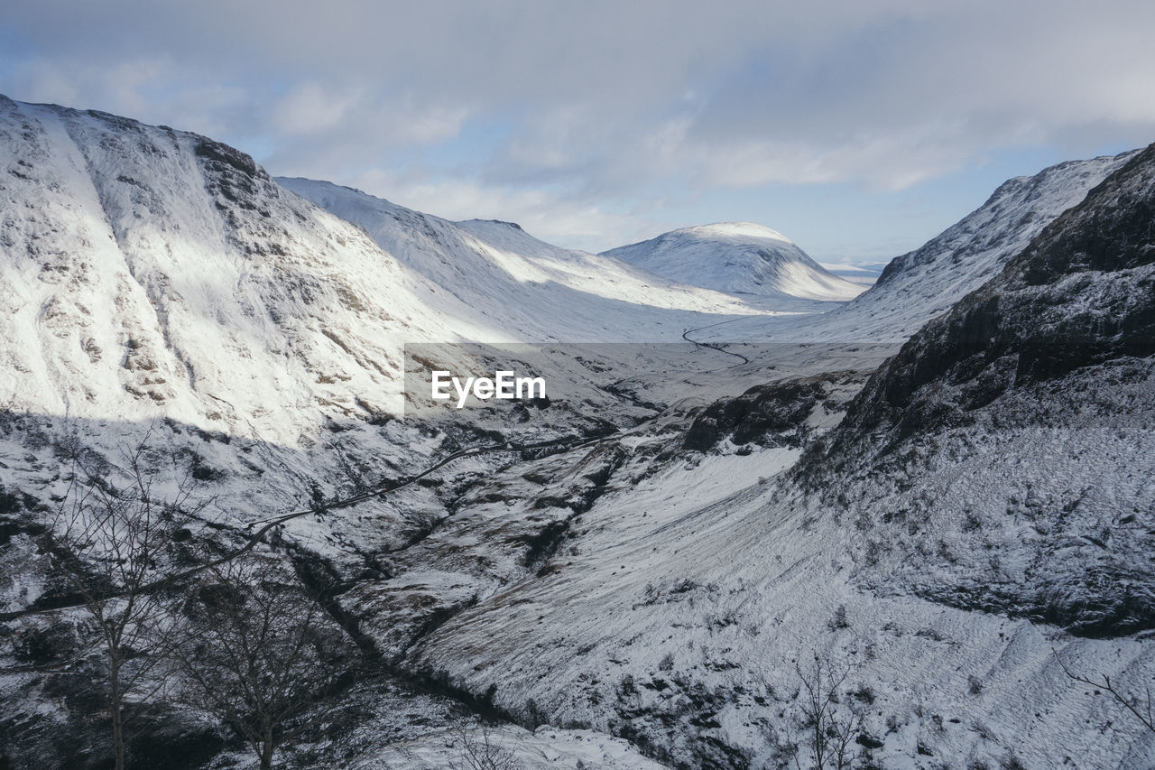 Scenic view of mountains against sky during winter