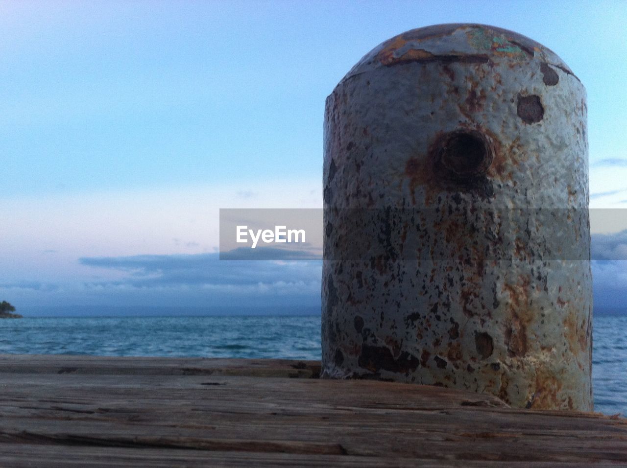 Mooring bollard on jetty at seaside