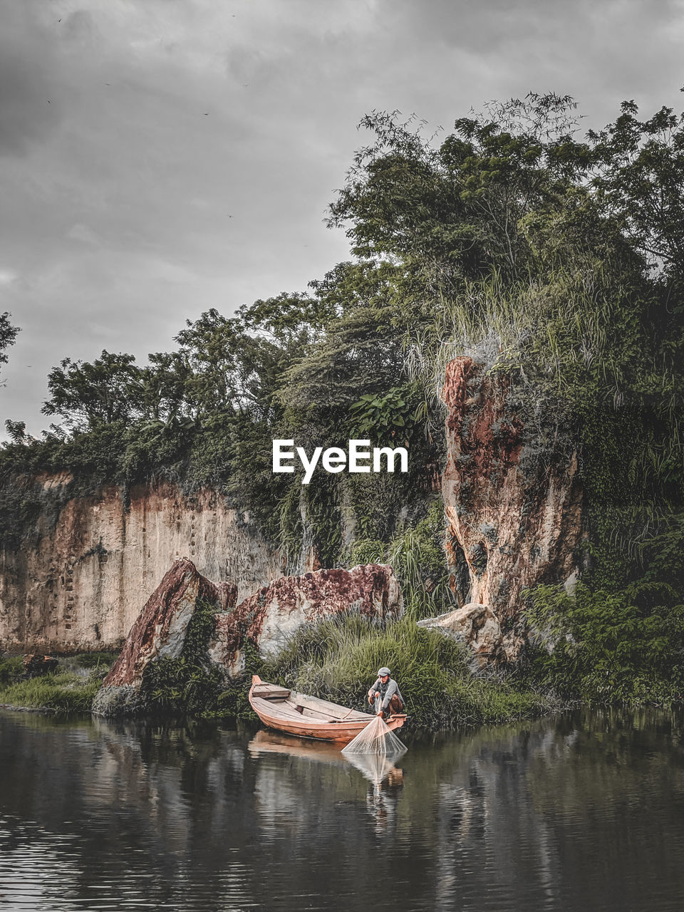 Man fishing in lake