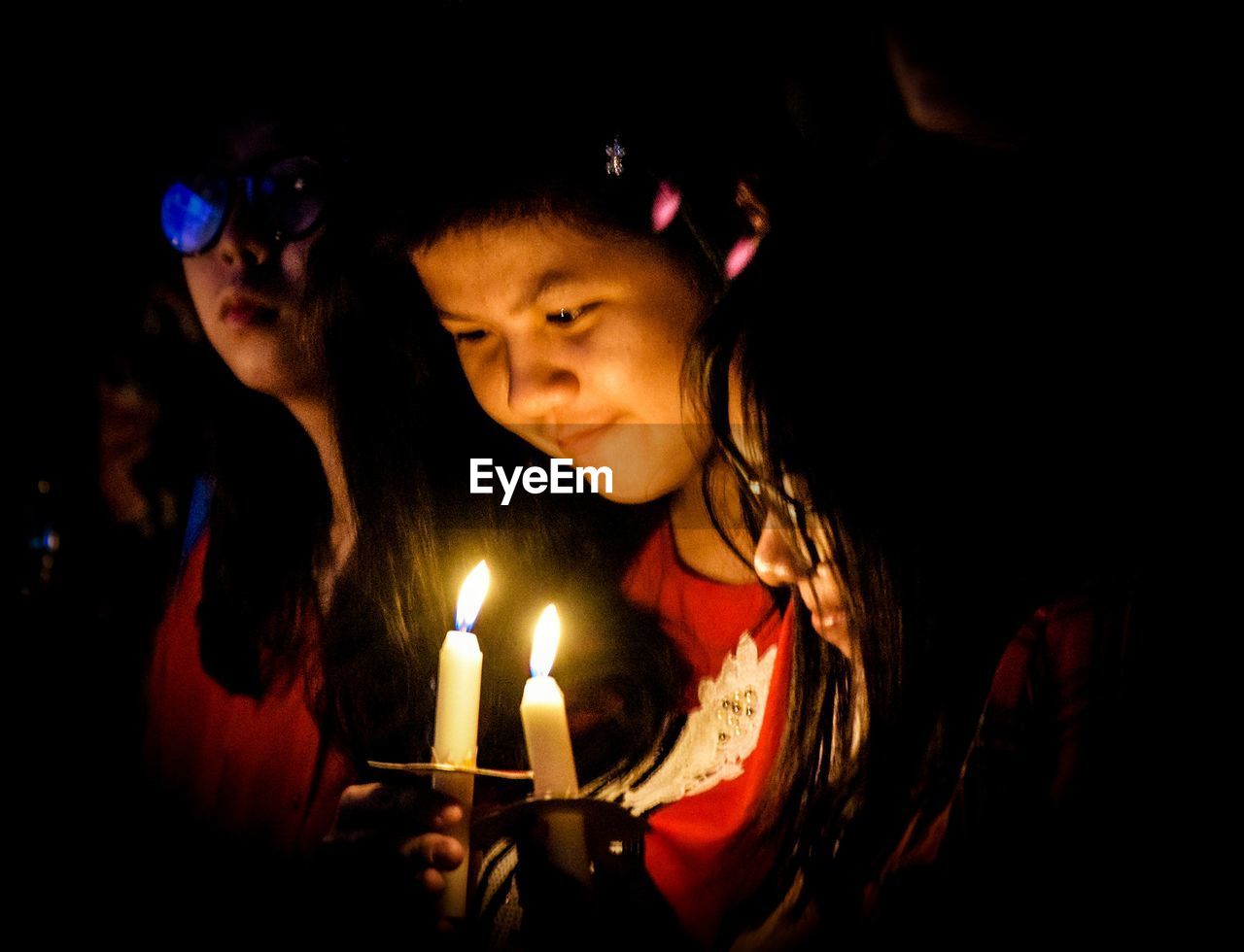 HIGH ANGLE PORTRAIT OF FRIENDS WITH ILLUMINATED LIGHT