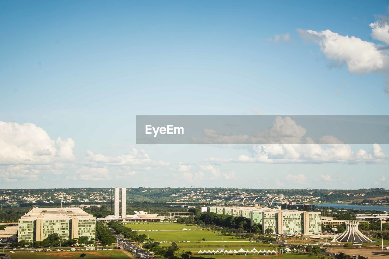 High angle view of buildings in city against sky