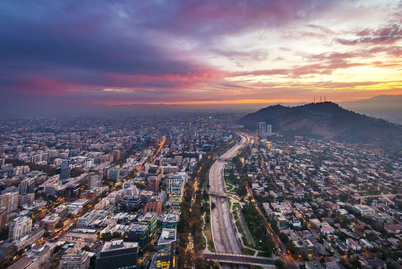 aerial view of cityscape against sky at sunset