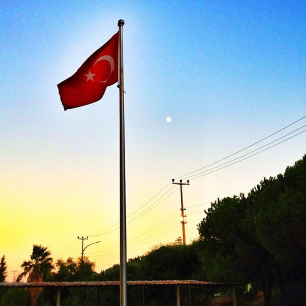 VIEW OF STREET LIGHT AGAINST CLEAR SKY AT SUNSET