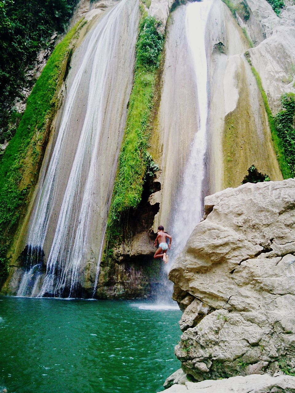 Man jumping into river