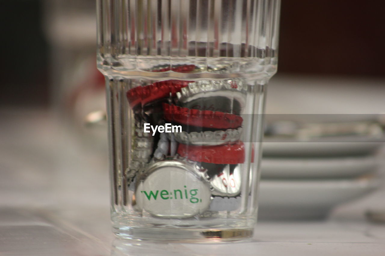 CLOSE-UP OF WATER IN JAR ON CONTAINER