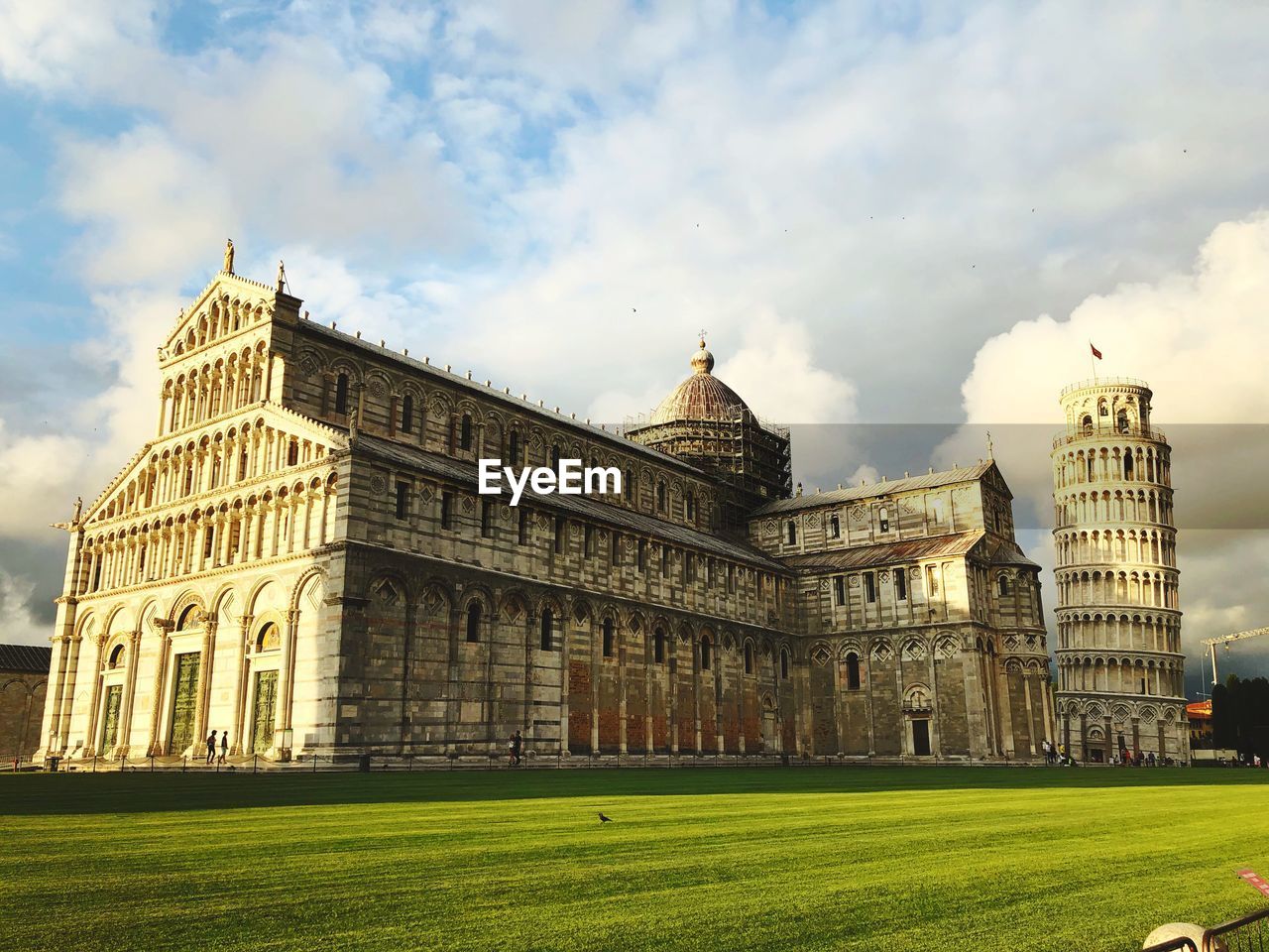 Low angle view of historical buildings against cloudy sky