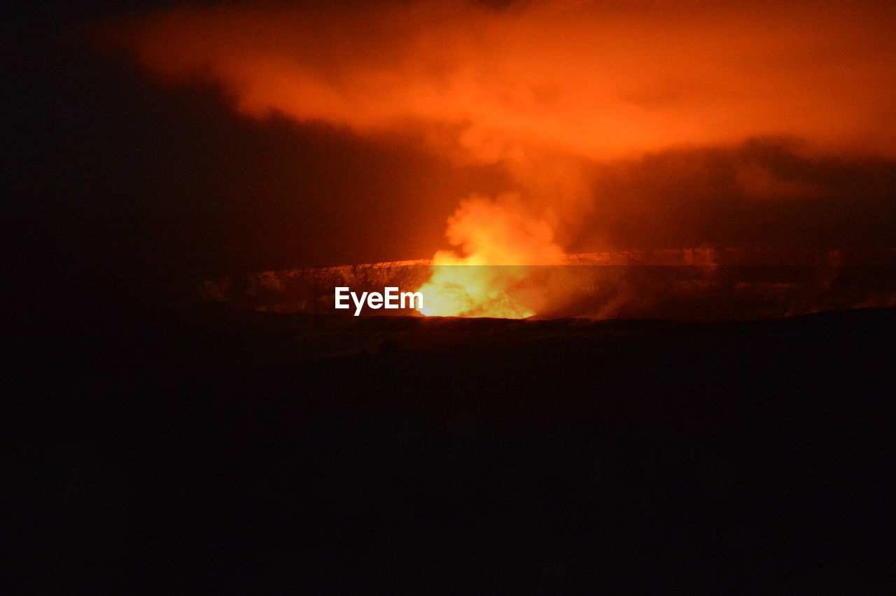 Smoke emitting from volcano at night