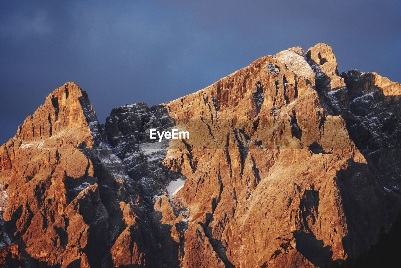 Scenic view of rocky mountains against sky