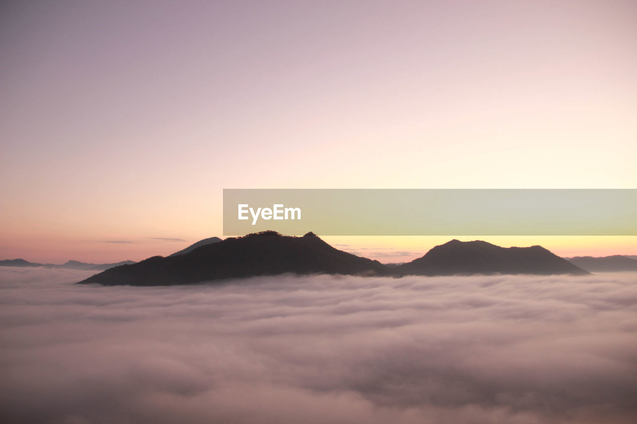 Scenic view of mountains against sky during sunset