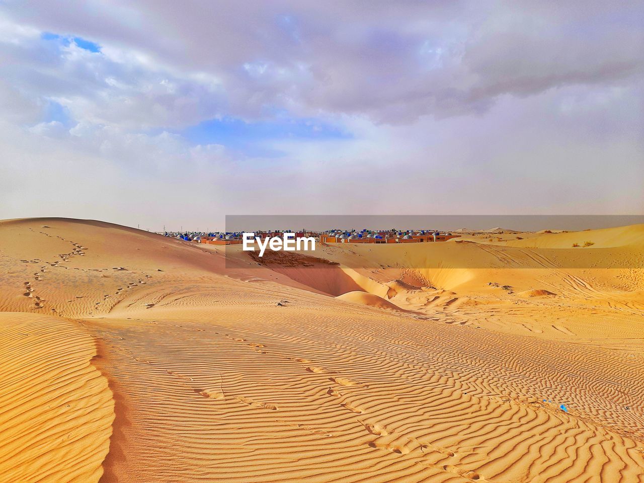 Sand dune and clouds in desert of algeria
