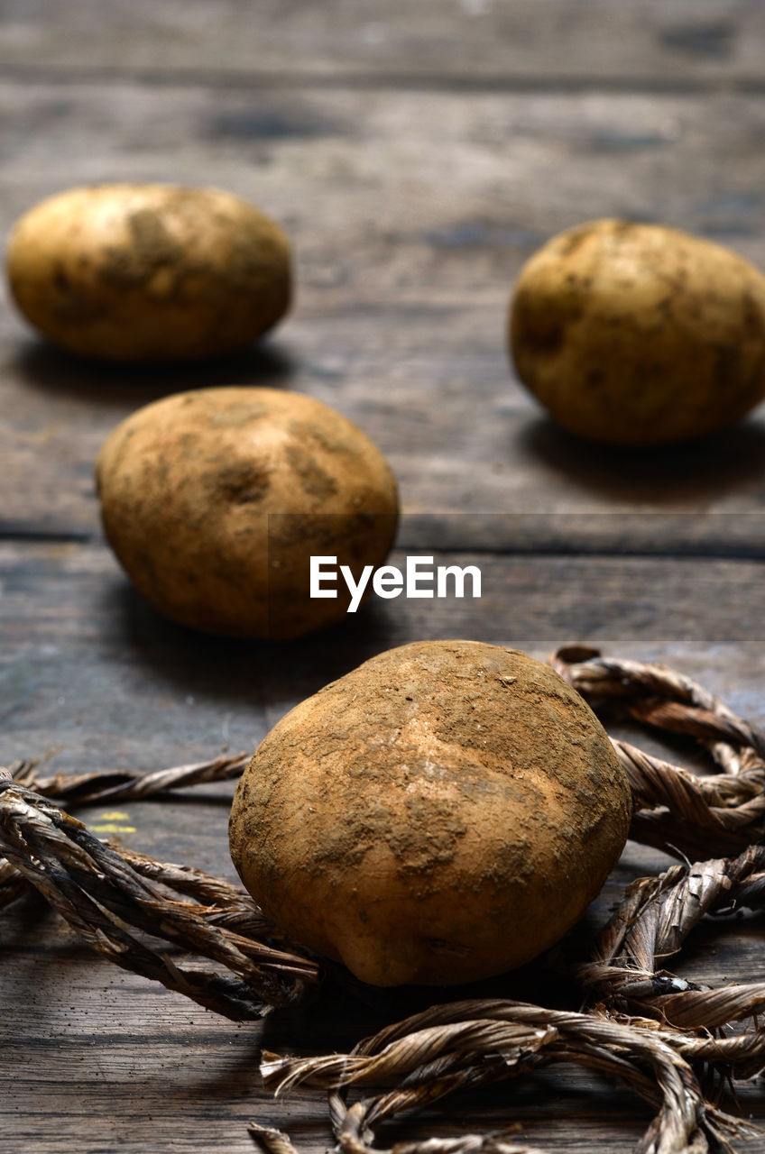 food and drink, food, freshness, healthy eating, wellbeing, produce, still life, no people, indoors, close-up, wood, vegetable, brown, studio shot, raw food, table, organic, plant, group of objects, ingredient, raw potato, focus on foreground