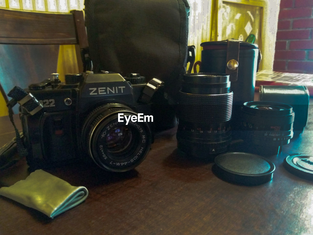 CLOSE-UP OF CAMERA AND TABLE ON MIRROR