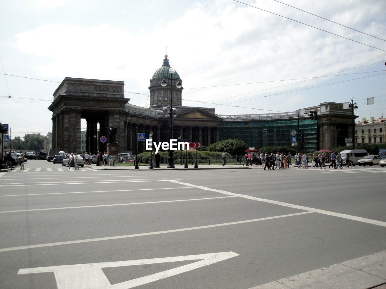 People on road in city against sky