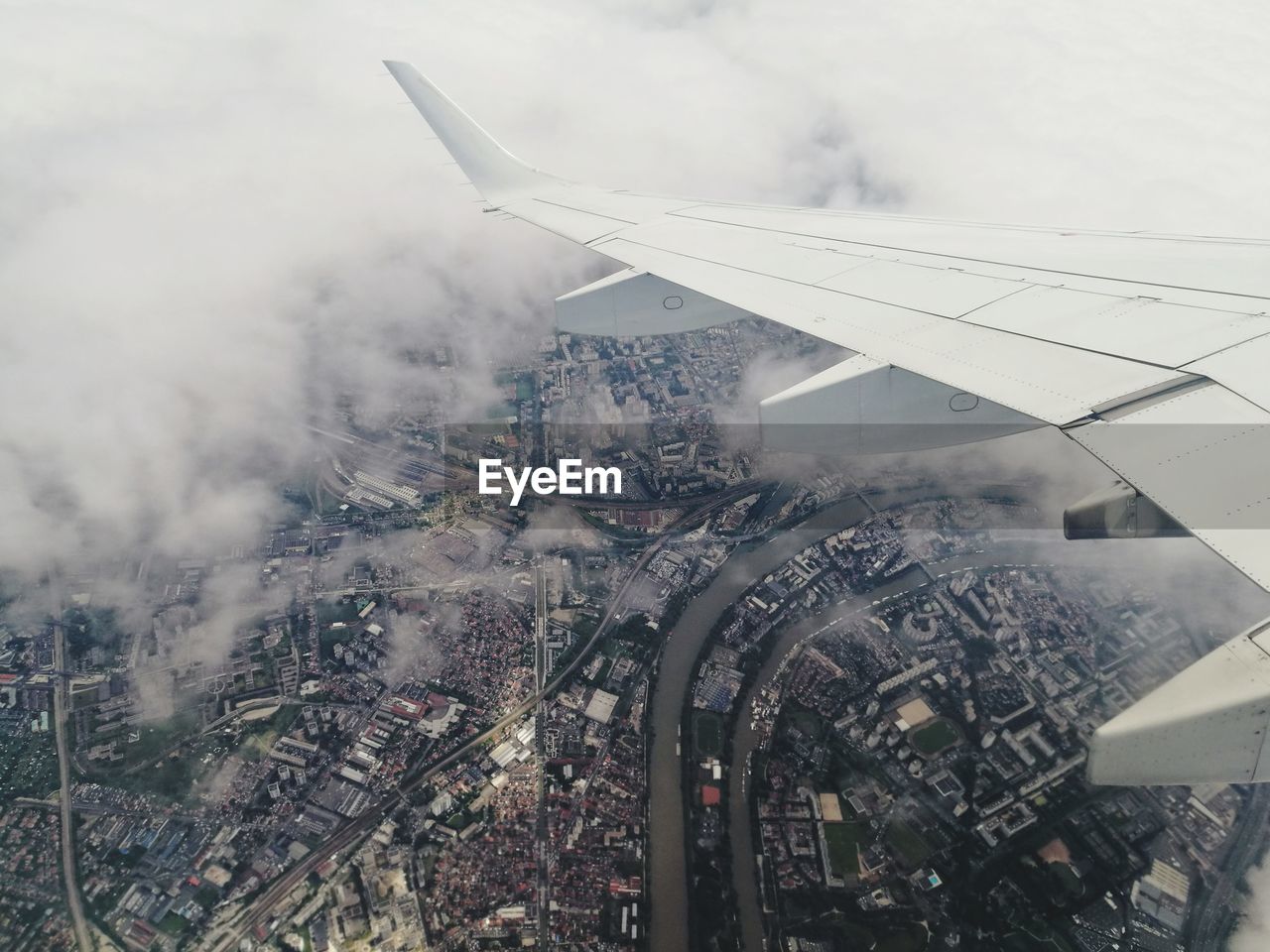 High angle view of airplane flying over paris