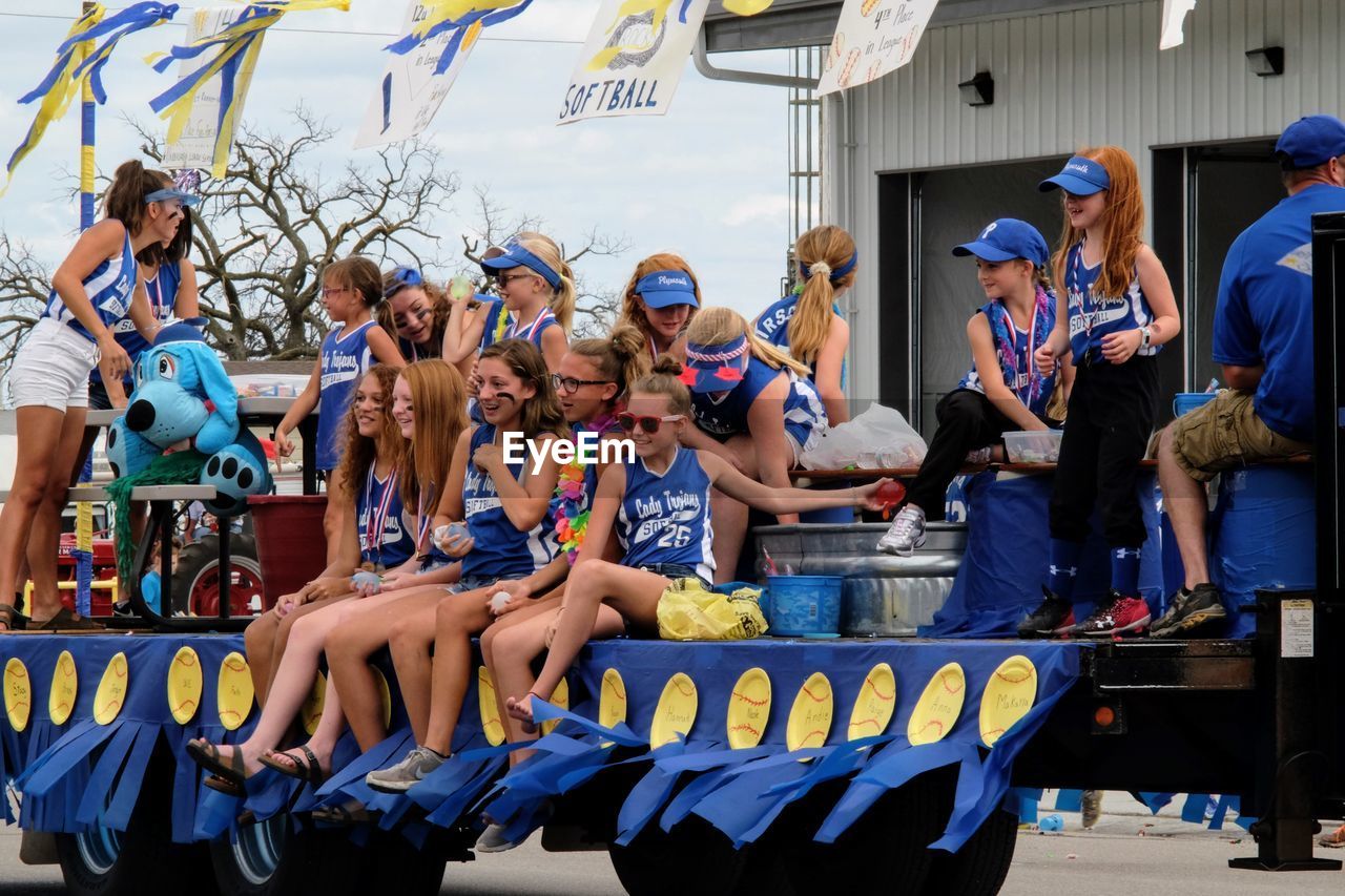 GROUP OF PEOPLE SITTING IN THE STADIUM