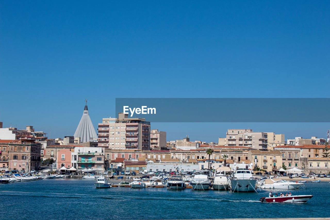 The maritime part of siracusa, with tourists on a trip to its waters