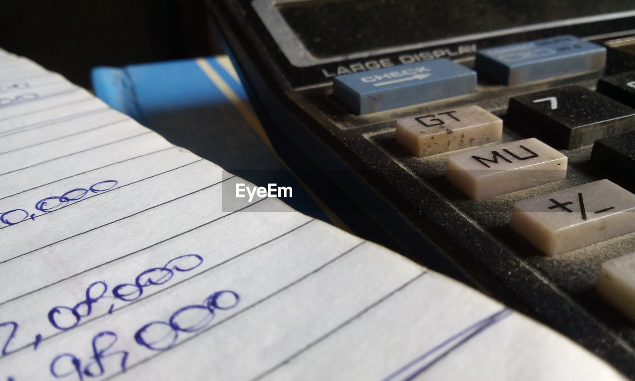 CLOSE-UP OF TELEPHONE ON TABLE