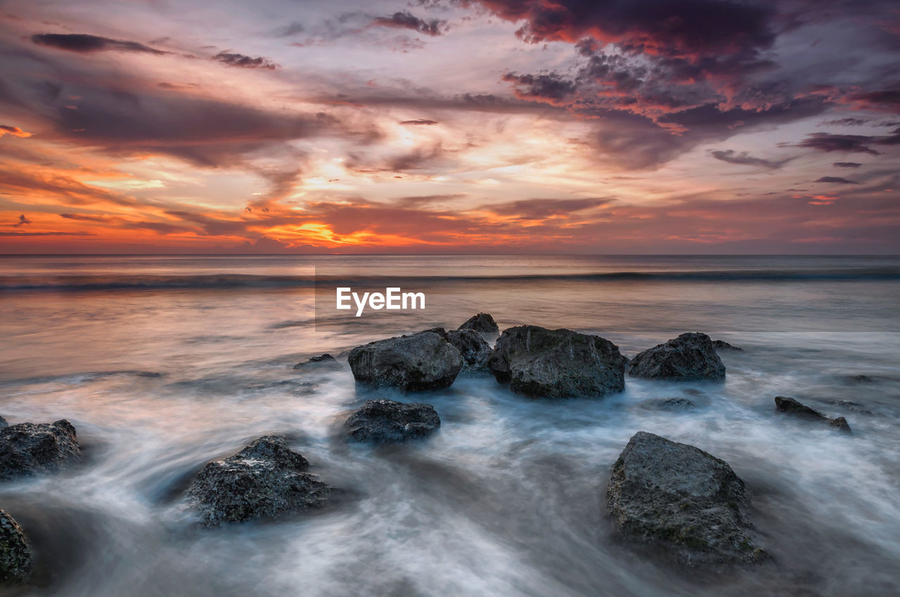 Scenic view of sea against sky during sunset