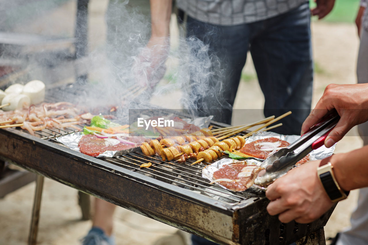 Midsection of man preparing food