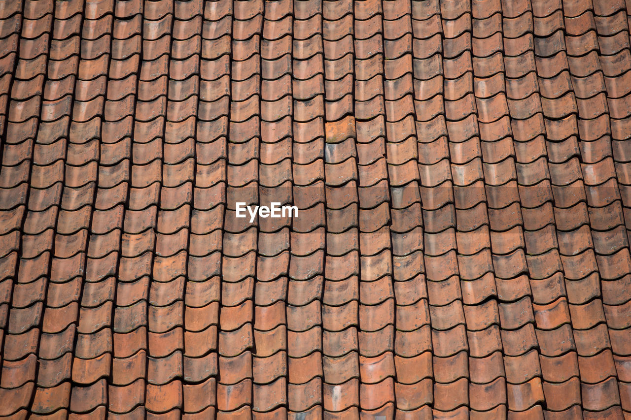 FULL FRAME SHOT OF ROOF TILES AND BUILDING