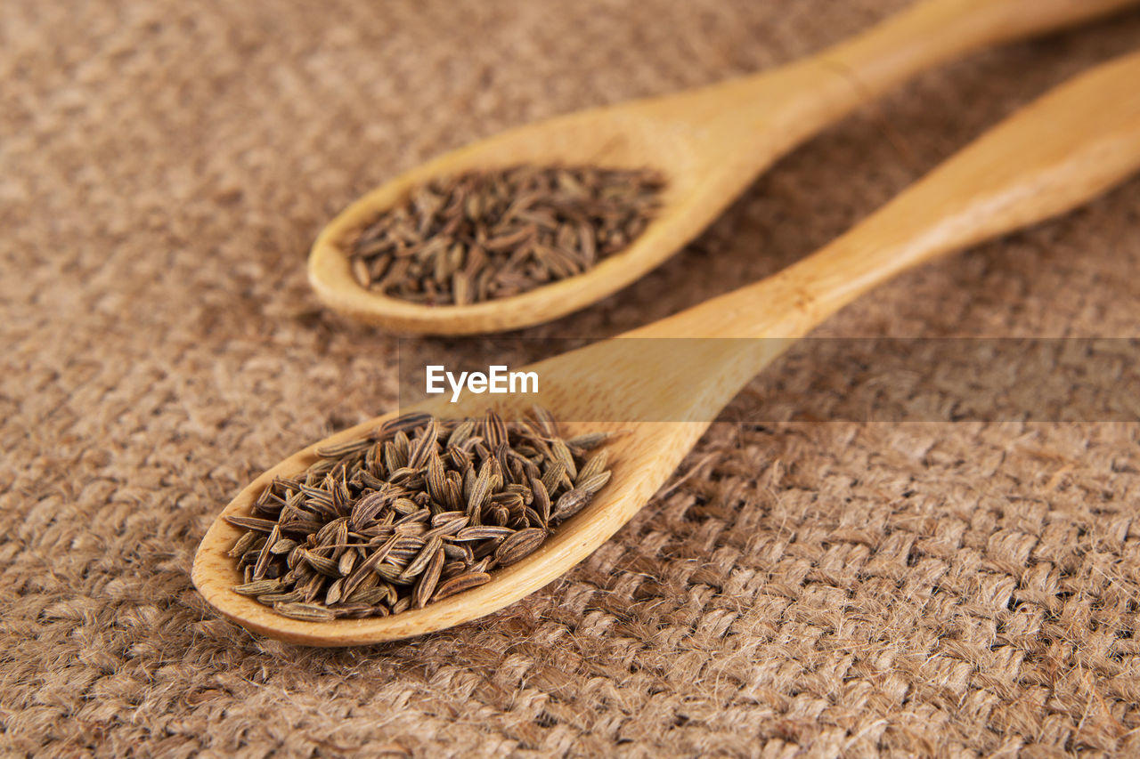 Close-up of ingredient in wooden spoon on table