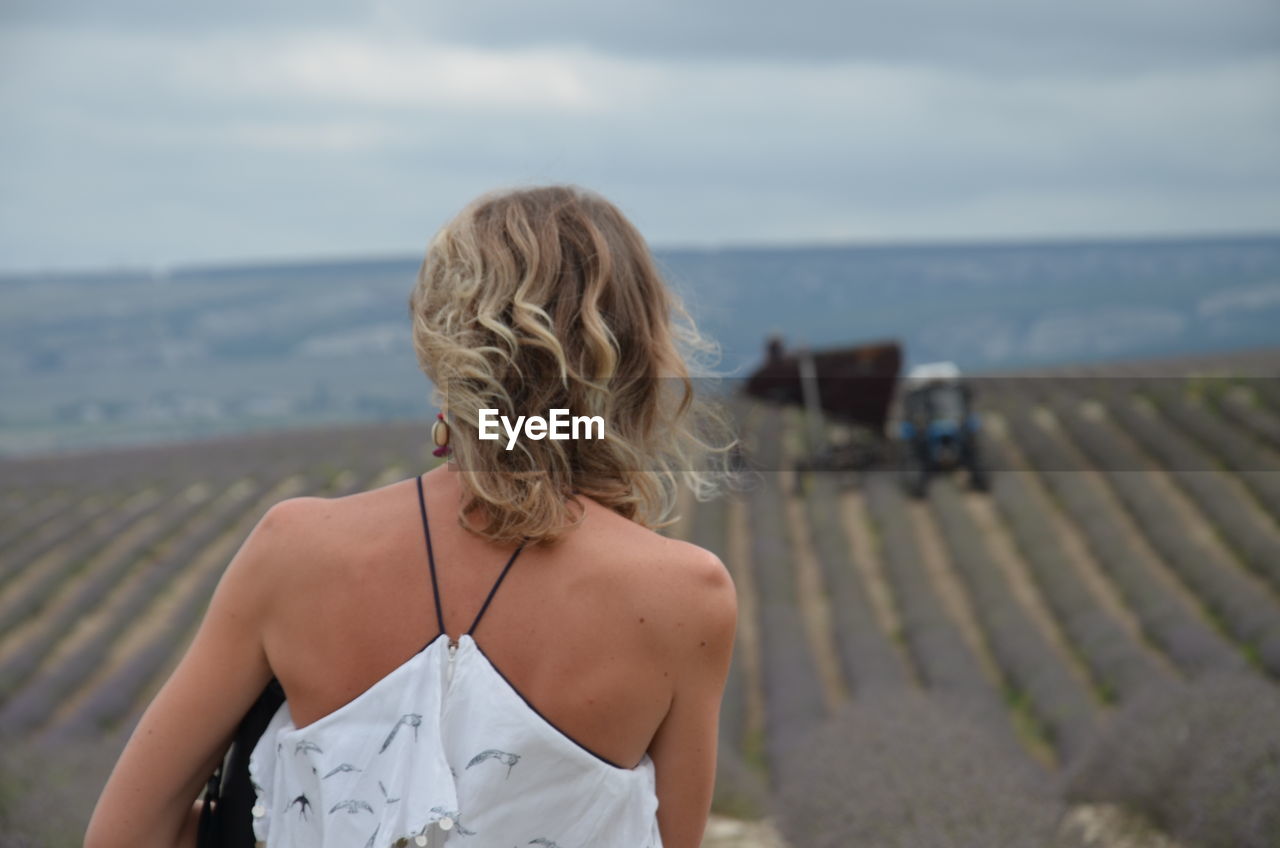 Rear view of woman looking at sea