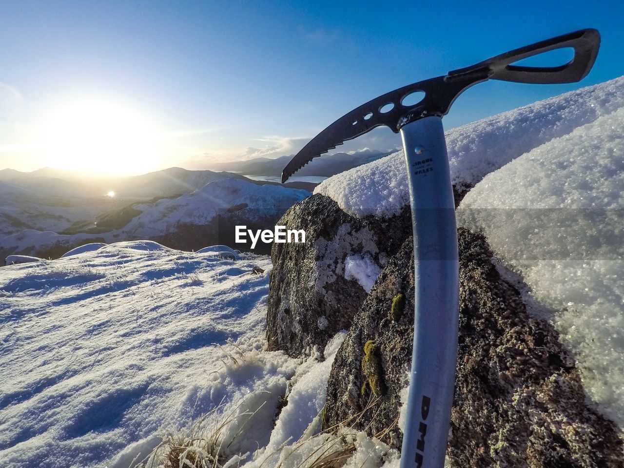 SNOW ON MOUNTAIN AGAINST SKY